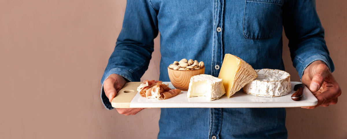 Pottery charcuterie board with meats and cheeses