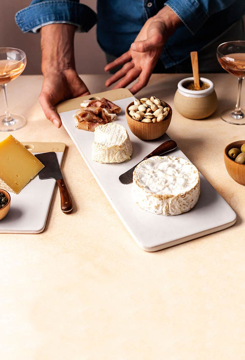 Pottery charcuterie board with meats and cheeses